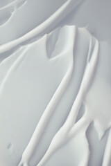 Cosmetic cream milk texture white colored smudge background	