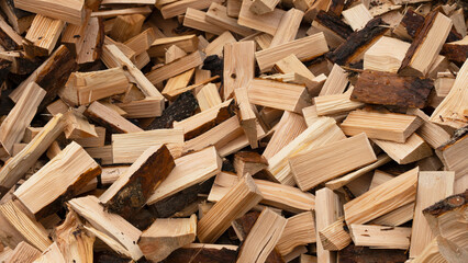 Chopped wood texture. flat logs piled in a heap