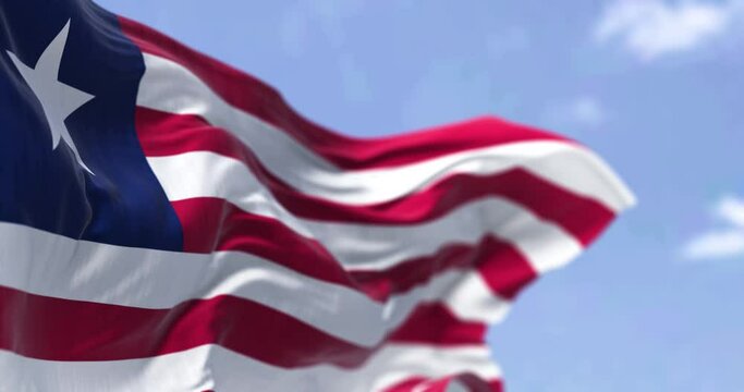 Detail of the national flag of Liberia waving in the wind on a clear day. Liberia is a country on the West African coast. Selective focus. Seamless looping in slow motion