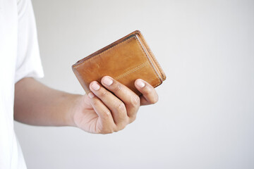 Man hand open an empty wallet with copy space.