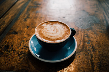 cup of coffee on wooden table