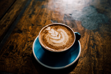 cup of coffee on wooden table