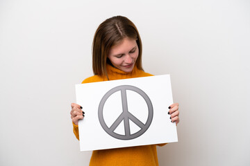 Young English woman isolated on white background holding a placard with peace symbol