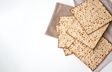 Banner. Layout of  Traditional Matzah prepared for Passover on white background. top view. Spring Holiday of Jewish people. Fasting time. Space for text. 