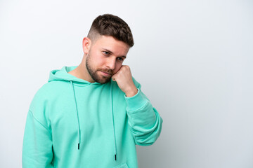 Young caucasian man isolated on white background with tired and bored expression