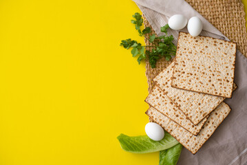Banner. Layout of  Traditional Matzah prepared for Passover with egg, green salad and parsley on...