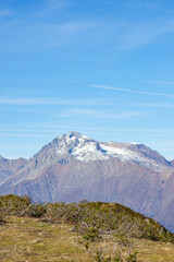 Fototapeta premium Mountain landscapes with peaks and valleys with plants and blue sky. A sunny day is good for a trip to the mountains and adventures