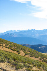 Naklejka premium Mountain landscapes with peaks and valleys with plants and blue sky. A sunny day is good for a trip to the mountains and adventures