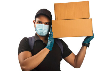 Young delivery man wearing face mask holding carton box and hearing in uniform