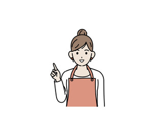 上に指をさす主婦　エプロン姿の女性　話す　説明　ポーズ