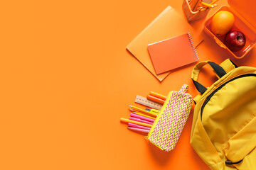 Different stationery, backpack and fruits on color background
