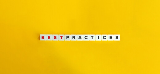 Best Practices Phrase on Block Letter Tiles on Yellow Orange Background. Minimal Aesthetics.