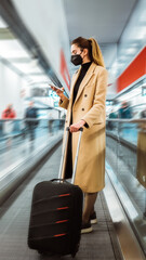 Traveller at the airport. Traveling during covid19. Vertical image. 