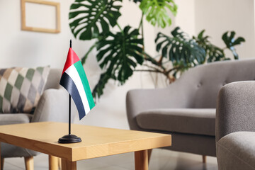 UAE flag on table in modern living room, closeup