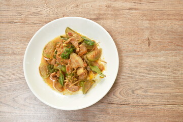 stir fried spicy wild boar and finger root with red curry on plate