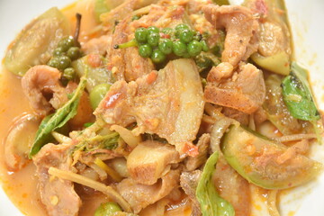 stir fried spicy wild boar and finger root with red curry on plate