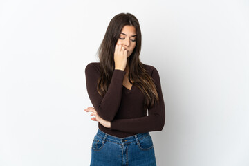 Teenager Brazilian girl isolated on white background having doubts