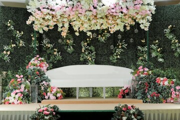 Fototapeta na wymiar Bridal dais, wedding stage decoration built for the bride and groom on their wedding day. The couple will sit on the dais or pelamin