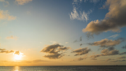 Fototapeta na wymiar sunrise sky clouds over the sea