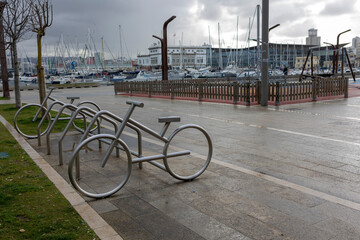 Empty parking for bicycles in cloudy weather without people