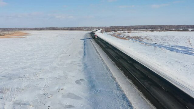 Trans-Siberian highway. Traffic on the Omsk - Novosibirsk AH6 "Irtysh" highway. Aerial view.