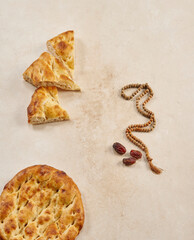 Ramadan date turkish culture style with pita rosary and coffee.