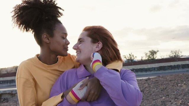 Happy women gay couple having tender moments outdoor - Lgbt and love relationship concept