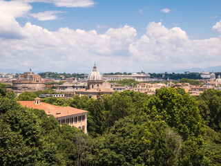 Fototapeta na wymiar Panoramic scenic view of Rome, capital of Italy. With Basilica of San Giovanni dei Fiorentini and Castel Sant'Angelo (The Mausoleum of Hadrian). Seen from the Janiculum hill.