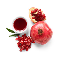 Tasty pomegranates and bowl with jam on white background