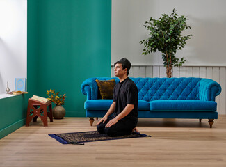 Praying man in the living room home house concept.