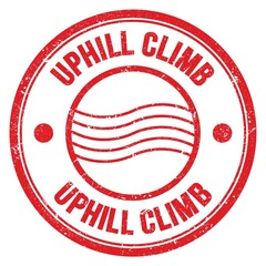 UPHILL CLIMB text written on red round postal stamp sign