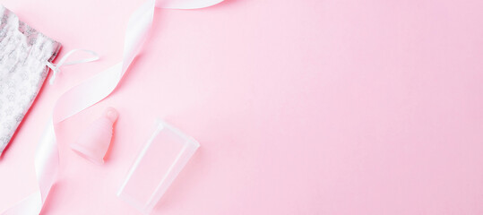 Menstrual cycle sanitary cup. Pink ribbon with menstrual cup. Menstruation feminine period. Sanitary hygiene banner. Use menstrual cup inside vagina.