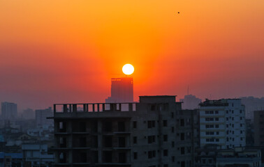 Sunset or sunrise at the city with building silhouette. Sunrise cityscape. Copy space.