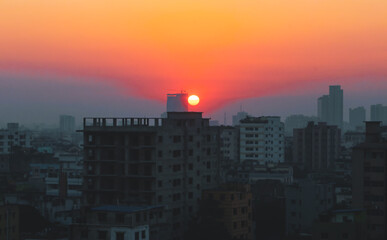 Sunset or sunrise at the city with building silhouette. Sunrise cityscape. Copy space.