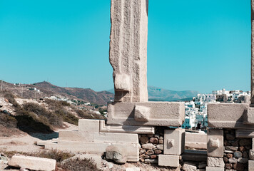 Naxos Island, Greece - 07.21.2021 : Temple of Appolo in Small Cyclades, monument on blue sky...