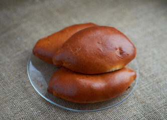 baked pies on a transparent plate