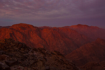 Obraz na płótnie Canvas Beautiful sunrise on the summit of the Mount Sinai (Mount Horeb, Holy Mount Moses or Gabal Musa), Egypt, North Africa.
