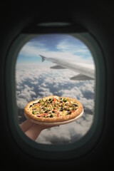 Photo of food, fast pizza delivery to the plane.