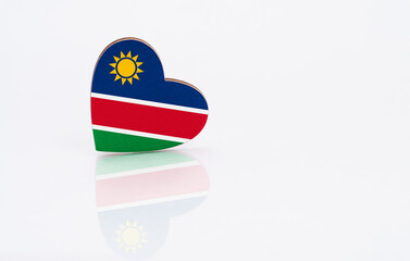 Flag of Namibia in the shape of a heart on a white background. The concept of patriotism. copyspace.