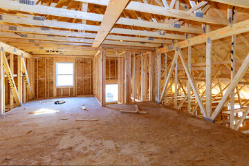 Fragment of a new home under construction wood framing beams