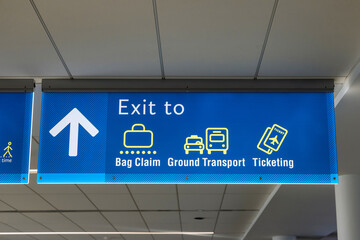 International Airport sign board Baggage Claim Ground Transport Ticketing in interior air terminal
