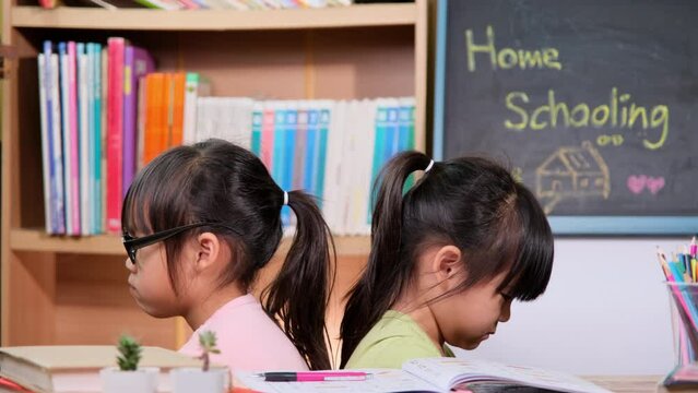 Two little sisters quarreled with each other. Family relationship problems.