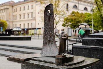 A tiny copy of Taras Shevchenko monument wearing a mask during pandemic covid-19 in Lviv