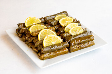 Stuffed leaves with olive oil on a white background. Traditional Turkish cuisine. Local name...
