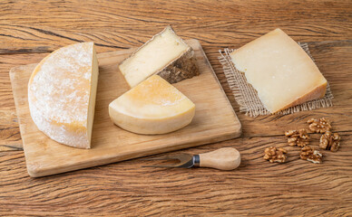 Artisanal Canastra, Tulha and Pardinho cheese from Brazil over wooden board