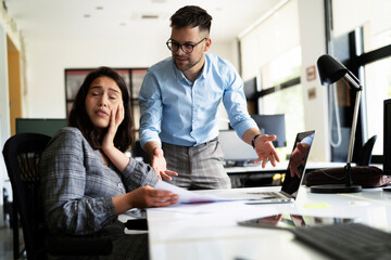 Colleagues arguing in office. Angry businessman yelling at his collegue.