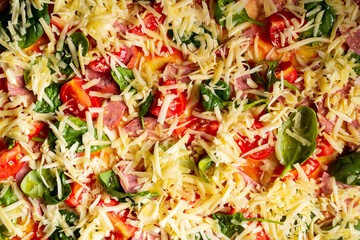 Background from pizza close-up with sausage, herbs, cheese.