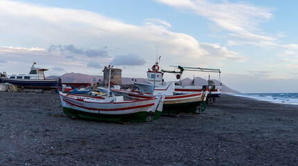 colorful fishing boats on the beach in Cabo de Gata at twilight