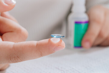 close-up. contact lens on a child's finger. 