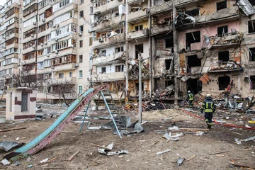 Zelfklevend Fotobehang War of Russia against Ukraine. Residential building damaged in Kyiv © misu